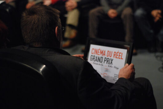 15 Mars - Cérémonie de Clôture. Palmarès. Le réalisateur Volker Koepp avec son Grand Prix du Cinéma du Réel pour son film HOLUNDERBLÜTE © Nicolas Rapin